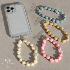 Telefoonsieraad bowtie pearl pink